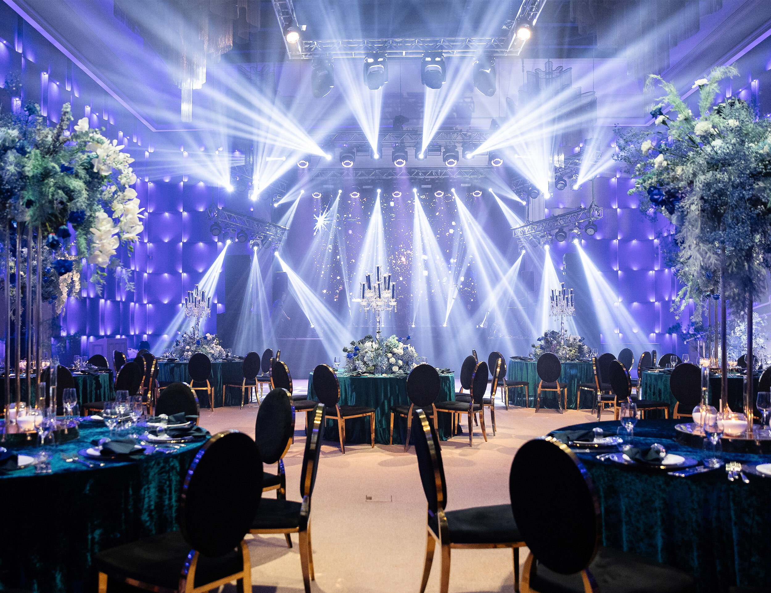 Mesmerizing lighting theme creating a magical ambiance at an Indian Sangeet celebration.